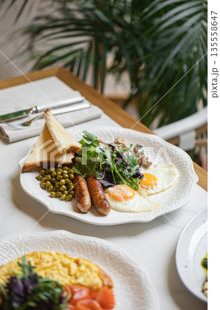 Breakfast plate with eggs sausages and toast Breakfast plate with eggs sausages and toast 135558647