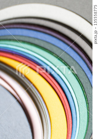 Closeup of colorful paper sheets in curved arrangement isolated on white 135558775