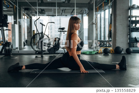 Wide twine. Young woman is in the gym 135558829