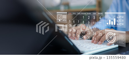 Business person hands typing on laptop with virtual calendar schedule and digital target goal icon. Time management, meeting deadline, strategic planning and organization concept. Business person hands typing on laptop with virtual calendar schedule and digital target goal icon. Time management, meeting deadline, strategic planning and organization concept. 135559480