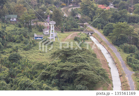 Canal and drainage system from Drainage Khun Dan Prakan Chon Dam with scenery cuts through lush green hills amidst beautiful nature. Canal and drainage system from Drainage Khun Dan Prakan Chon Dam with scenery cuts through lush green hills amidst beautiful nature. 135561169