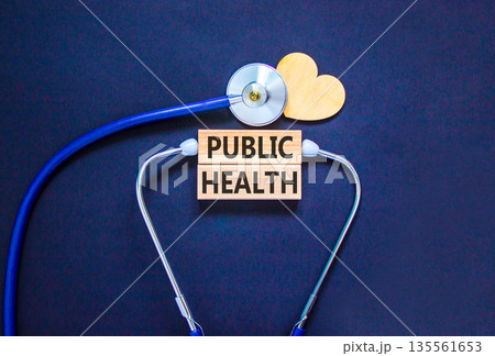 Public health symbol. Concept words Public health on beautiful wooden blocks. Wooden heart and stethoscope. Beautiful black background. Medical healthy lifestyle public health concept. Public health symbol. Concept words Public health on beautiful wooden blocks. Wooden heart and stethoscope. Beautiful black background. Medical healthy lifestyle public health concept. 135561653