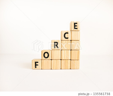 Force symbol. Concept word Force on beautiful wooden blocks. Beautiful white table white background. Business lifestyle force concept. Copy space. Force symbol. Concept word Force on beautiful wooden blocks. Beautiful white table white background. Business lifestyle force concept. Copy space. 135561738