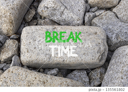 Break time symbol. Concept word Break time on beautiful grey stone on stone beach. Beautiful grey stone beach background. Business break time concept. Copy space. 135561802
