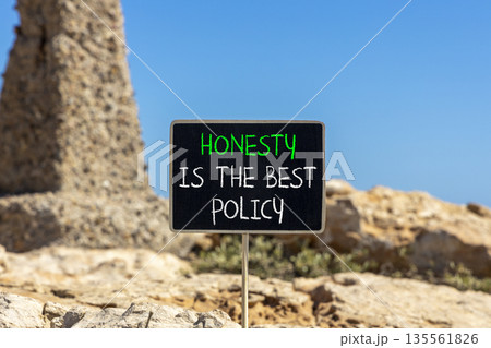 Honesty is the best policy symbol. Concept words Honesty is the best policy on beautiful blackboard. Beautiful stone and blue sky background. Business honesty is the best policy concept. Copy space. Honesty is the best policy symbol. Concept words Honesty is the best policy on beautiful blackboard. Beautiful stone and blue sky background. Business honesty is the best policy concept. Copy space. 135561826