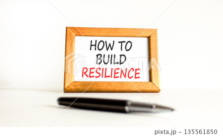 How to build resilience symbol. Concept words How to build resilience on beautiful wooden picture frame. Beautiful white background. Black pen. Business how to build resilience concept. Copy space. How to build resilience symbol. Concept words How to build resilience on beautiful wooden picture frame. Beautiful white background. Black pen. Business how to build resilience concept. Copy space. 135561850