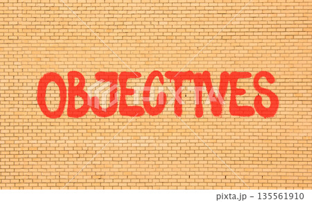 Objectives symbol. Concept word Objectives on beautiful big brown brick wall. Beautiful big brown brick wall background. Business objectives concept. Copy space. Objectives symbol. Concept word Objectives on beautiful big brown brick wall. Beautiful big brown brick wall background. Business objectives concept. Copy space. 135561910