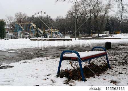 there is a bench in the snowy park there is a bench in the snowy park 135562183
