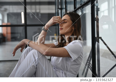 Feeling bad, tired. Woman doctor is in the office Feeling bad, tired. Woman doctor is in the office 135562327