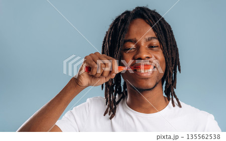 Stomatology, oral hygiene. Black man is in the studio against soft background 135562538