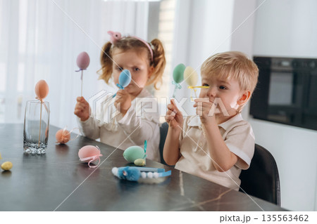 Easter conception. Kids are preparing bakery at home 135563462