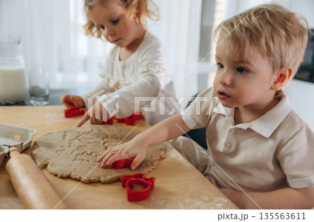 Home made product, preparing. Kids are preparing bakery Home made product, preparing. Kids are preparing bakery 135563611