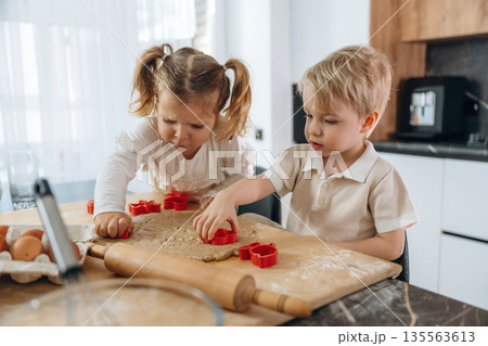 Kids are preparing bakery at home 135563613
