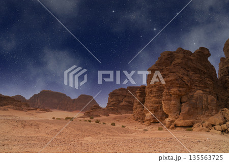 Wadi Rum desert. Valley of the Moon landscape under night sky with stars and rock formations 135563725