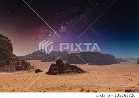 Starry night sky over desert landscape in Wadi Rum, Jordan during late evening hours Starry night sky over desert landscape in Wadi Rum, Jordan during late evening hours 135563726