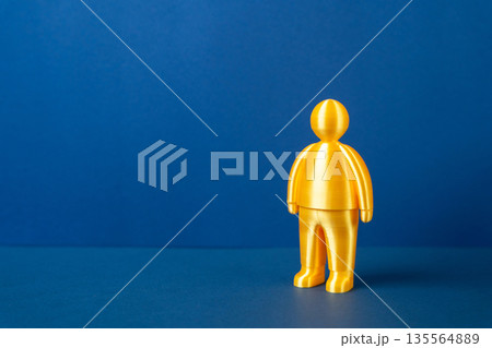 A figurine of a golden man. Talented and successful. Awarded and recognized. Achievement symbol concept, excellence and status. Motivation, leadership potential and professional recognition. A figurine of a golden man. Talented and successful. Awarded and recognized. Achievement symbol concept, excellence and status. Motivation, leadership potential and professional recognition. 135564889