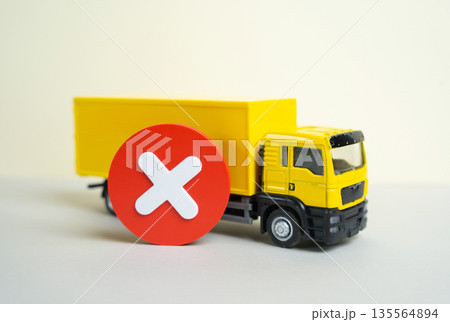 A truck and a cancellation or prohibition sign. Restrictions on the entry of trucks. Transport regulation concept, access limits, urban policy and impact on logistics and supply chains. 135564894