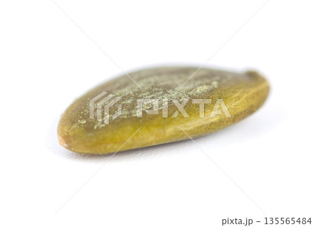 Pumpkin seed isolated on white background. food. Macro shot Pumpkin seed isolated on white background. food. Macro shot 135565484