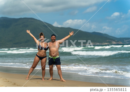 A man and a woman on vacation at the seaside A man and a woman on vacation at the seaside 135565811