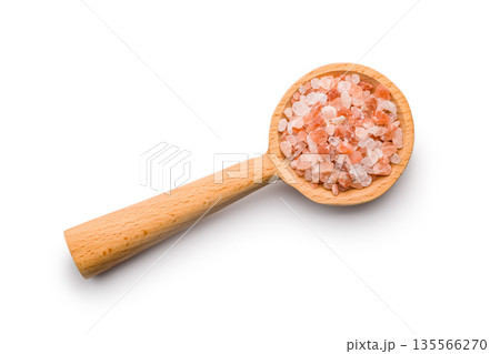 Pink Himalayan salt on wooden spoon isolated on white background. 135566270