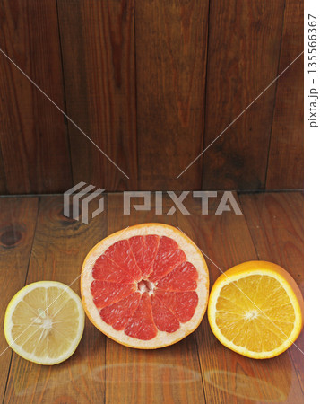 Orange grapefruit lemon divided in half. Healthful concept. Healthy lifestyle 135566367