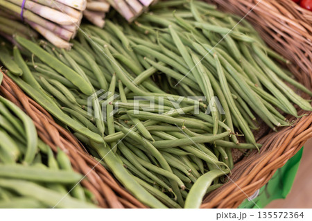 Pile of green beans displayed at market 135572364