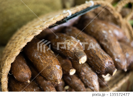 High quality imported eco cassava are grouped stored in window in wicker basket or cardboard box 135572477