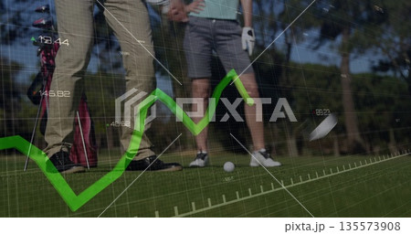 Golf partners lining up putt on putting green, with line graph overlay and numeric markers 135573908