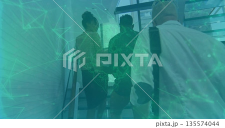 Ascending three professionals in suits scaling metal stairs at office building, with green overlay Ascending three professionals in suits scaling metal stairs at office building, with green overlay 135574044