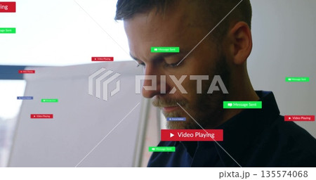 Standing man in dark shirt viewing office with Message Sent media playing notifications, copy space 135574068