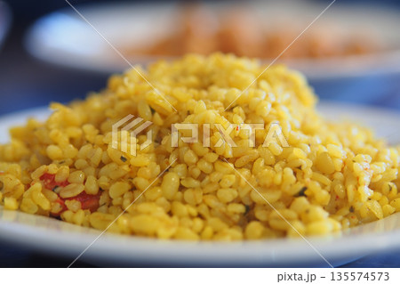 closeup of bulgur rice on a white plate  135574573