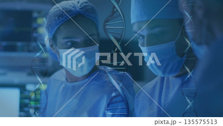 Standing surgical team wearing light blue scrubs in operating room, with overlaid DNA graphics 135575513