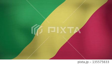 Displaying national flag of Congo waving on studio backdrop, with green yellow red diagonal stripes 135575633