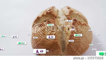 Resting round rustic bread loaf showing social media icons with counters on studio tabletop Resting round rustic bread loaf showing social media icons with counters on studio tabletop 135575828