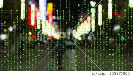 Cascading green binary digits overlaying wet city street, with neon signs and pedestrians walking 135575906
