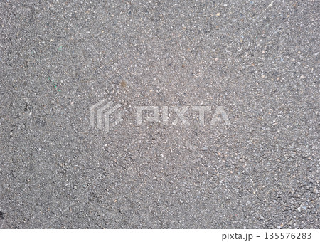 This is a close-up of an asphalt road. 135576283