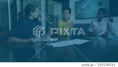 Discussing strategy business professionals analyzing charts at conference room, with tablet laptop 135576533