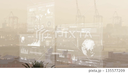 Floating digital dashboards showing maps and charts at seaport, with container cranes, palm frond Floating digital dashboards showing maps and charts at seaport, with container cranes, palm frond 135577209