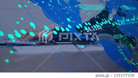 Typing woman wearing dark blazer at office desk, with silver laptop keyboard, market chart overlays Typing woman wearing dark blazer at office desk, with silver laptop keyboard, market chart overlays 135577330