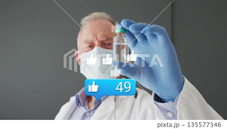 Inspecting vial, doctor wearing mask and gloves in lab with floating thumbs up icons showing 49 135577346