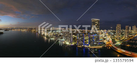 Aerial panoramic view of Miami skyline. Panoramic cityscape of Miami with coastal skyscrapers. Panoramic view of Miami Beach from above. Iconic landmarks line of Miami coastline. Miamis famous 135579594
