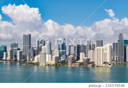 Famous landmarks of Miami Brickell from above. Drone view of the Brickell in Miami city. Business in Brickell district. Biscayne Bay Florida iconic urban coastline in daylight. 135579596