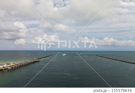 Panorama of Miami Beach with turquoise waters. Drone shot of Miami skyline. Top view of South Beach. Miami cityscape with luxury skyscrapers and ocean. View of Miami famous coastline. Panorama of Miami Beach with turquoise waters. Drone shot of Miami skyline. Top view of South Beach. Miami cityscape with luxury skyscrapers and ocean. View of Miami famous coastline. 135579639