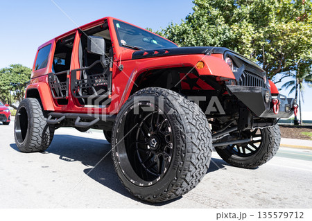 Miami, Florida, USA - November 23, 2024: Jeep JK Wrangler off road SUV red car. SUV car Jeep Wrangler. Car red color Jeep JK Wrangler outdoor. Jeep Wrangler, corner view Miami, Florida, USA - November 23, 2024: Jeep JK Wrangler off road SUV red car. SUV car Jeep Wrangler. Car red color Jeep JK Wrangler outdoor. Jeep Wrangler, corner view 135579712