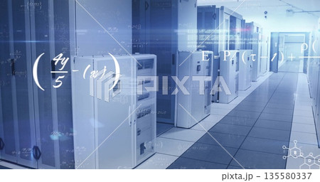 Glowing white server cabinets lining data center corridor, with LED lights and digital overlays 135580337