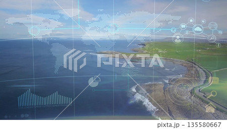 Displaying green headland extending into calm sea at shoreline, with digital map and chart overlays 135580667
