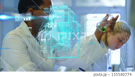 Holding flask scientist inspecting green liquid while colleague writing notes in lab, lock icon 135580774