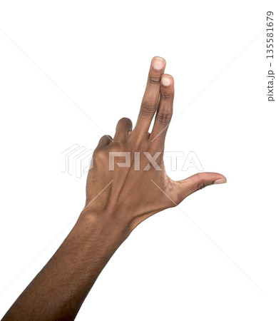 Hand sign with index and middle fingers tapping forward. Black skin male making controlled gesture Hand sign with index and middle fingers tapping forward. Black skin male making controlled gesture 135581679