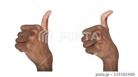 Thumb up hand gesture showing approval and like sign. Black skin male making positive signal for 135582480