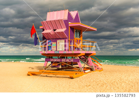 Lifeguard over Miami beach. Panoramic seascape of famous coastline. Summer in Miami Beach. Miami Beach jetty. Rescue tower against the blue sky in Miami. Beautiful coastal view of Florida. Lifeguard over Miami beach. Panoramic seascape of famous coastline. Summer in Miami Beach. Miami Beach jetty. Rescue tower against the blue sky in Miami. Beautiful coastal view of Florida. 135582793